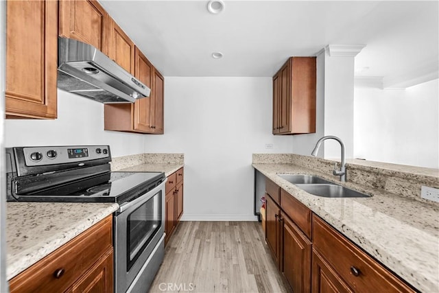 10535 Wilshire Blvd Unit D01, Los Angeles, CA 90024 - kitchen with electric stove, under cabinet range hood, a sink, light wood-style flooring, and light stone countertops