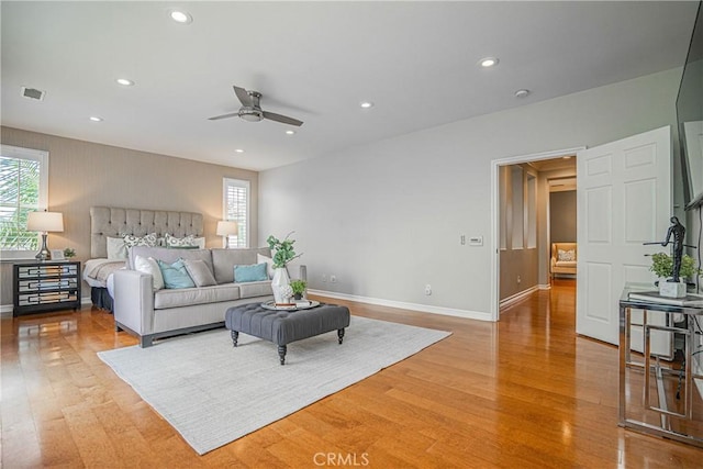 interior space featuring baseboards, light wood finished floors, and visible vents