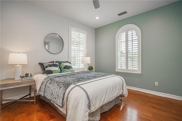 bedroom with visible vents, wood finished floors, baseboards, ceiling fan, and recessed lighting