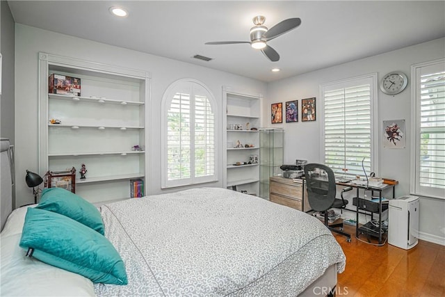 bedroom with visible vents, wood finished floors, baseboards, ceiling fan, and recessed lighting