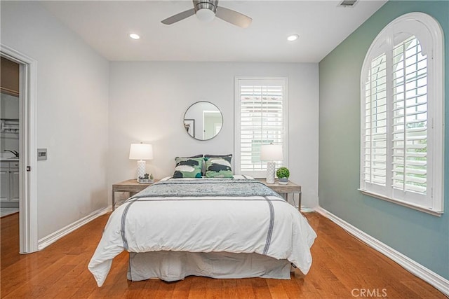 bedroom with baseboards, ceiling fan, recessed lighting, and wood finished floors
