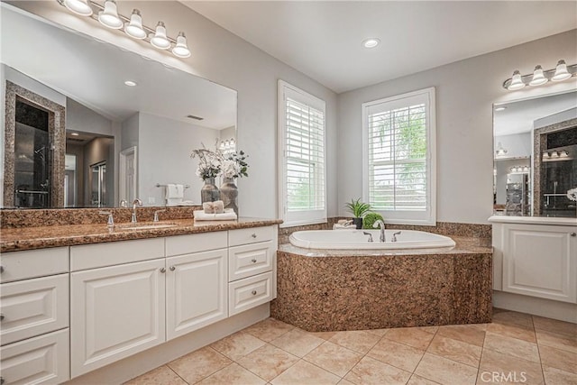 bathroom featuring vanity, tile patterned floors, recessed lighting, visible vents, and a garden tub