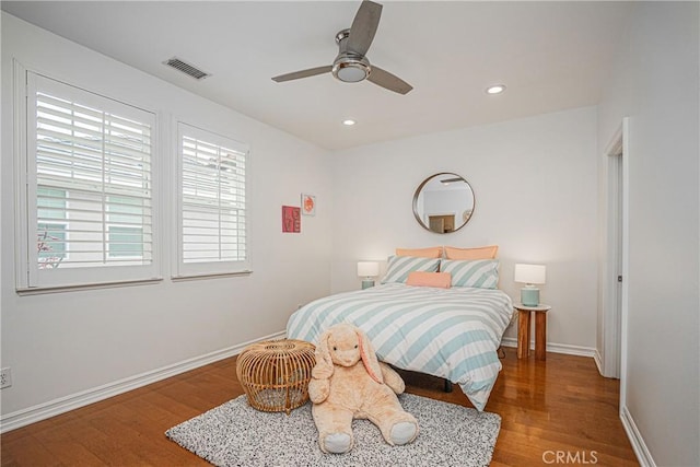 bedroom featuring visible vents, recessed lighting, baseboards, and wood finished floors