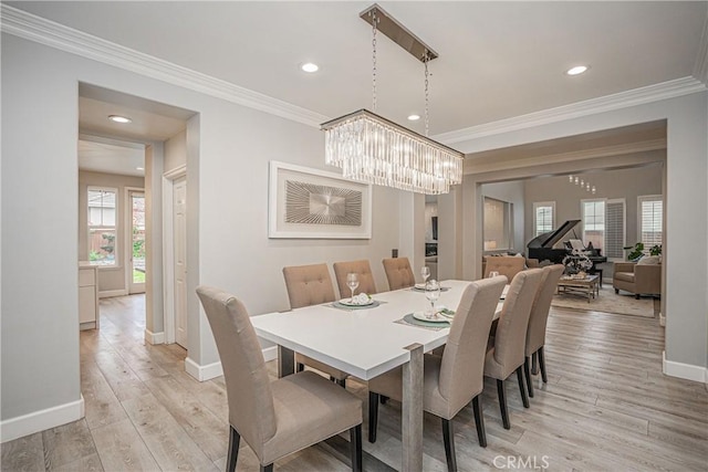 dining area with crown molding, baseboards, recessed lighting, and light wood finished floors