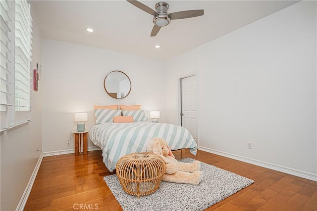 bedroom featuring recessed lighting, baseboards, ceiling fan, and wood finished floors