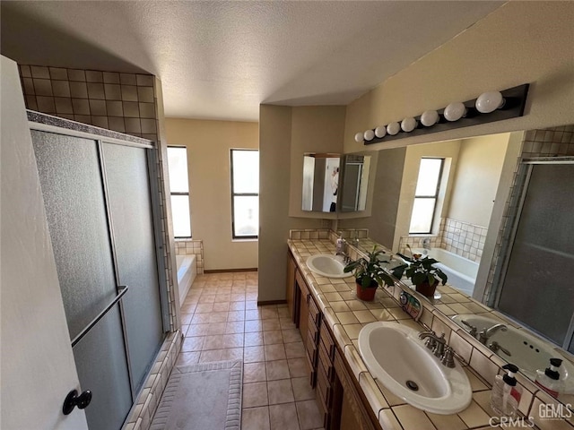 30830 Roan Ct, Tehachapi, CA 93561 - full bathroom with double vanity, a sink, a bath, and a stall shower