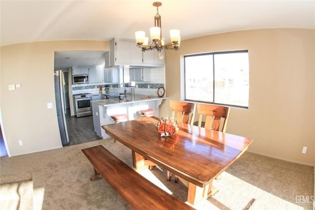 30830 Roan Ct, Tehachapi, CA 93561 - dining area featuring dark carpet and a chandelier