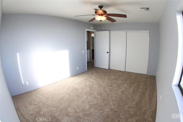 30830 Roan Ct, Tehachapi, CA 93561 - unfurnished bedroom featuring carpet flooring, a ceiling fan, visible vents, and a closet
