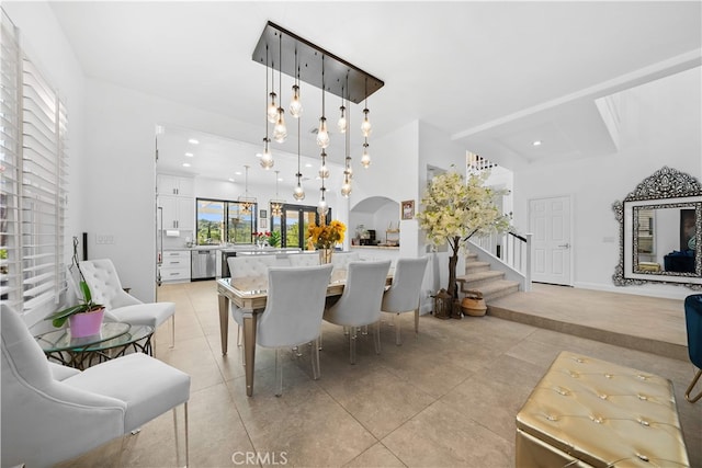 5 Westchester Ct, Coto De Caza, CA 92679 - dining space featuring light tile patterned floors, healthy amount of natural light, arched walkways, stairway, and recessed lighting