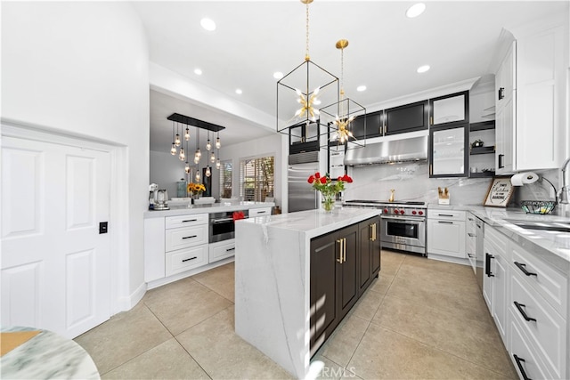 5 Westchester Ct, Coto De Caza, CA 92679 - kitchen with high end appliances, a chandelier, under cabinet range hood, light tile patterned flooring, and a sink