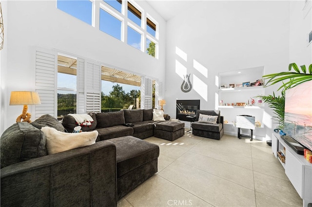 5 Westchester Ct, Coto De Caza, CA 92679 - living area featuring a high ceiling, light tile patterned flooring, and a glass covered fireplace