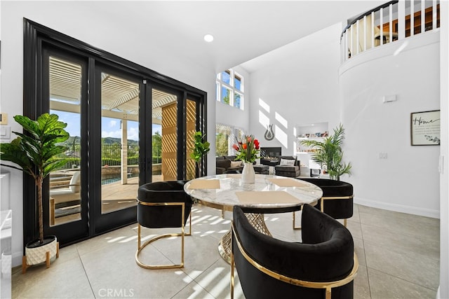 5 Westchester Ct, Coto De Caza, CA 92679 - dining room with french doors, light tile patterned floors, baseboards, and a towering ceiling