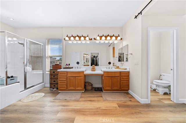 5 Westchester Ct, Coto De Caza, CA 92679 - bathroom featuring wood finished floors, a shower stall, vanity, and toilet