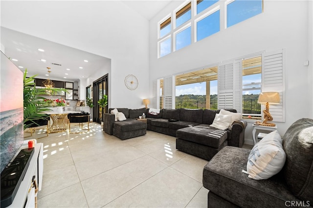 5 Westchester Ct, Coto De Caza, CA 92679 - living area with light tile patterned floors, a high ceiling, and recessed lighting