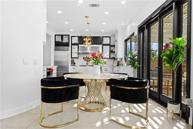 5 Westchester Ct, Coto De Caza, CA 92679 - bar with stainless steel built in refrigerator, recessed lighting, hanging light fixtures, baseboards, and backsplash