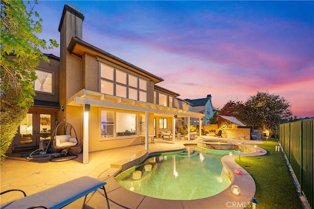 5 Westchester Ct, Coto De Caza, CA 92679 - back of house with french doors, a fenced backyard, stucco siding, a patio area, and a chimney
