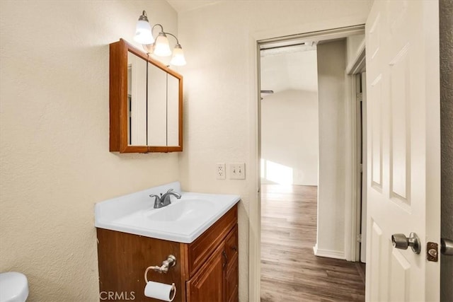 60803 Division St, Joshua Tree, CA 92252 - half bathroom featuring vanity and wood finished floors