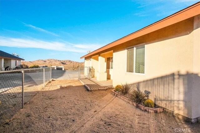 60803 Division St, Joshua Tree, CA 92252 - fenced backyard featuring a mountain view