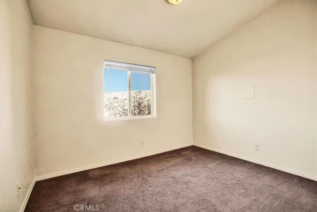 60803 Division St, Joshua Tree, CA 92252 - spare room with dark colored carpet and baseboards