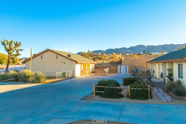 60803 Division St, Joshua Tree, CA 92252 - view of swimming pool featuring a storage unit and a mountain view