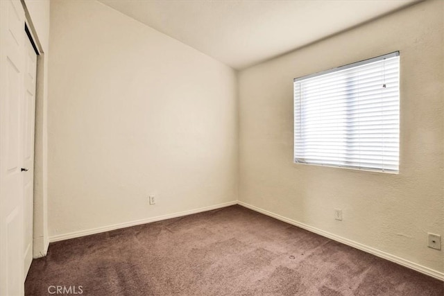 60803 Division St, Joshua Tree, CA 92252 - unfurnished bedroom with dark carpet and a closet