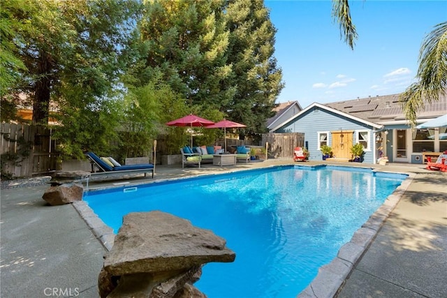 view of pool featuring an outdoor living space, fence, a fenced in pool, and a patio