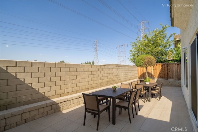 view of patio featuring outdoor dining area and a fenced backyard