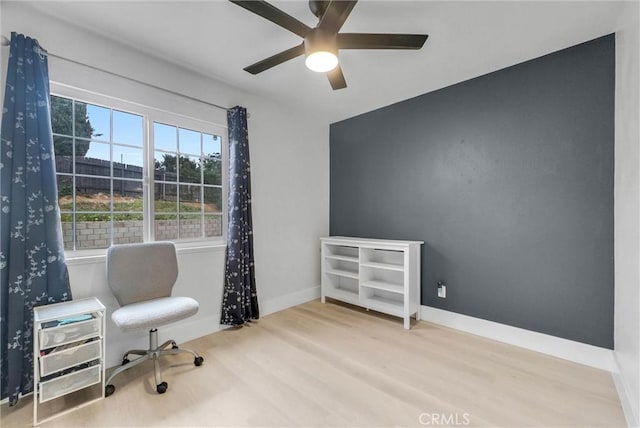 office featuring ceiling fan, wood finished floors, and baseboards