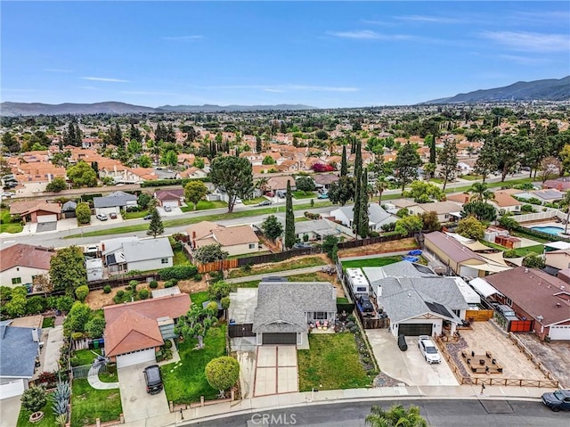 aerial view of residential area featuring a mountainous background