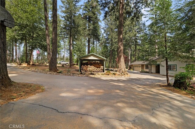 view of property's community with aphalt driveway