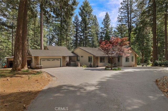 view of front of home with an attached garage and driveway