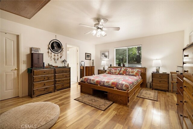 bedroom featuring a ceiling fan and light wood finished floors