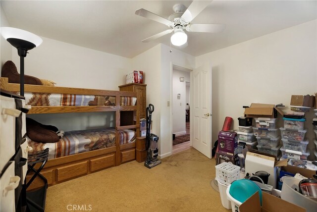 carpeted bedroom with a ceiling fan