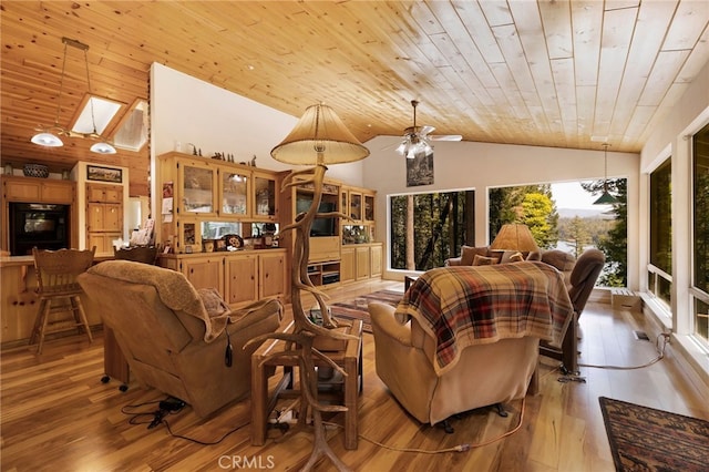 living area with light wood-type flooring, ceiling fan with notable chandelier, wooden ceiling, and high vaulted ceiling