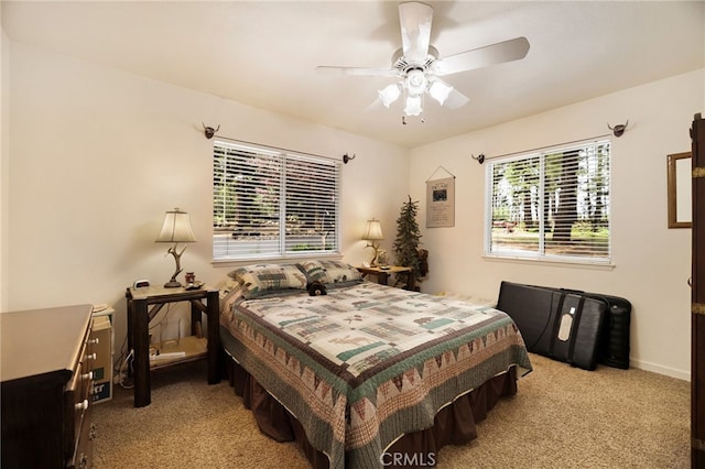 carpeted bedroom with a ceiling fan