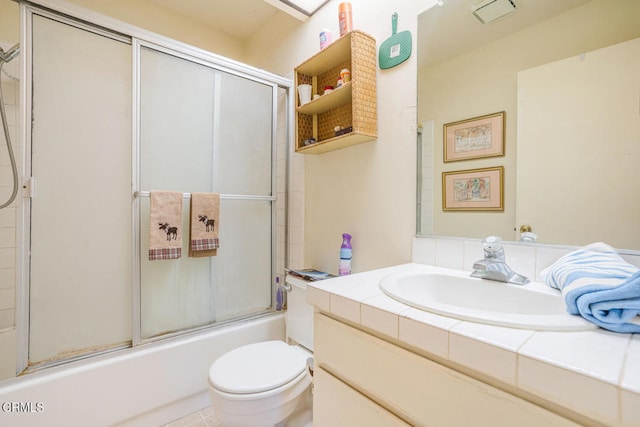 full bathroom featuring enclosed tub / shower combo, toilet, visible vents, and vanity