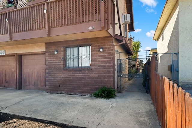 exterior space featuring a gate and a garage