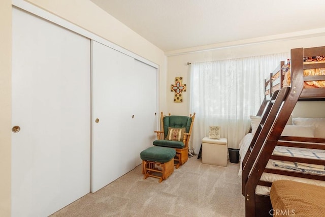 bedroom with carpet floors and a closet