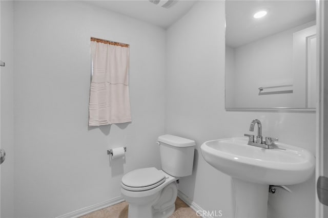 2017 Juniper Ln, Colton, CA 92324 - bathroom with toilet, baseboards, and a sink
