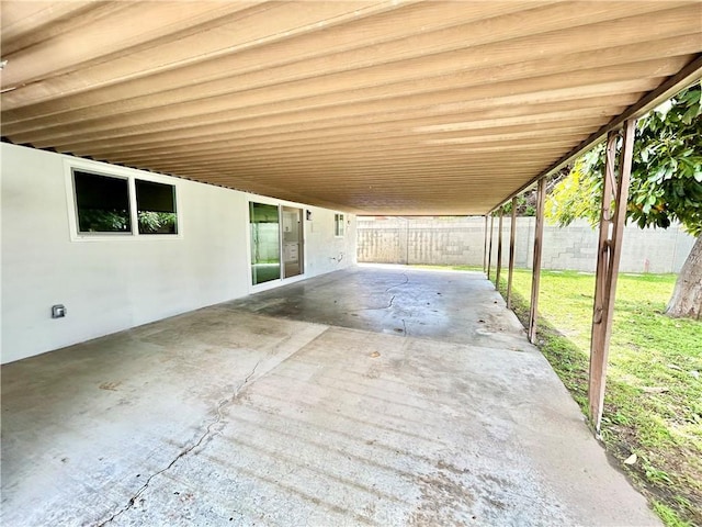 view of patio with a fenced backyard and an attached carport