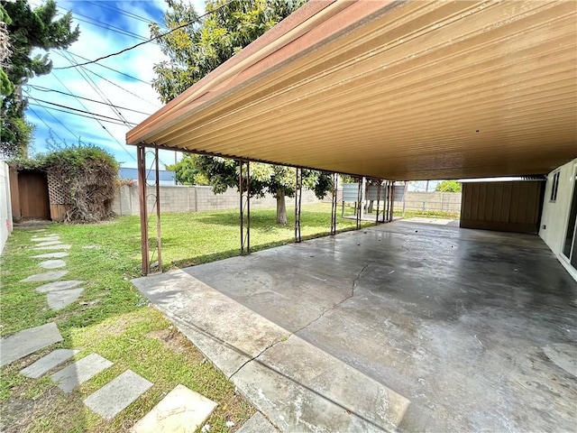 view of parking with fence