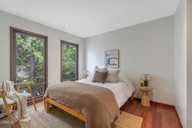 bedroom featuring recessed lighting, baseboards, and light wood-style floors