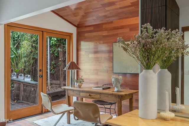 office space featuring wood walls, wood finished floors, vaulted ceiling, and wooden ceiling