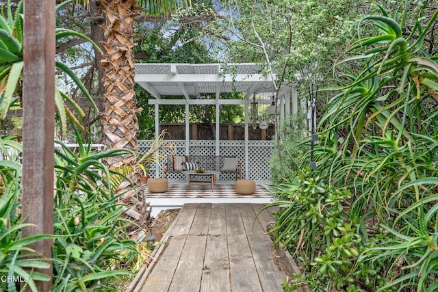view of patio with a wooden deck and a pergola