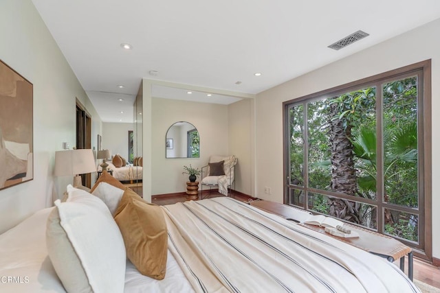 bedroom with recessed lighting and visible vents