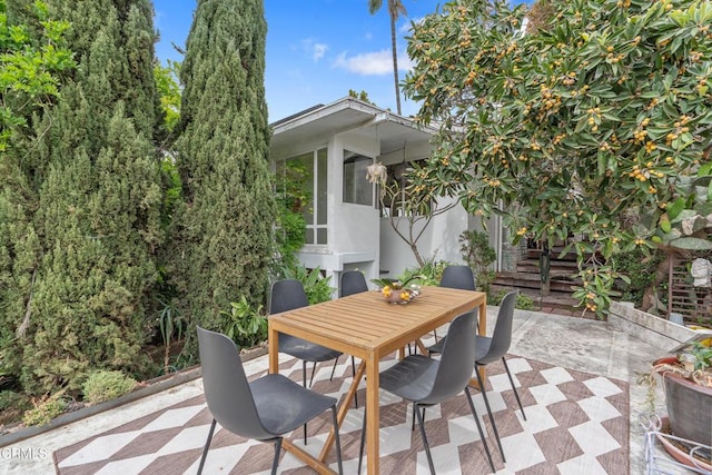 view of patio featuring outdoor dining space