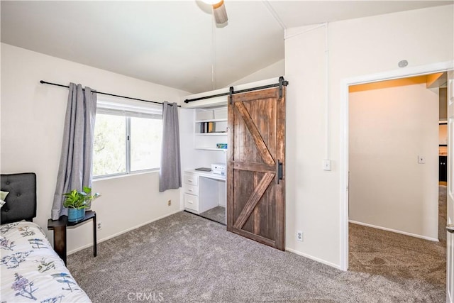 carpeted bedroom with baseboards, a ceiling fan, a barn door, and lofted ceiling