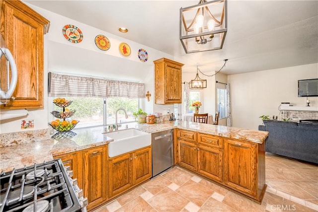 kitchen with an inviting chandelier, plenty of natural light, a sink, and dishwasher