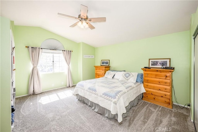 bedroom featuring carpet floors, a ceiling fan, baseboards, and lofted ceiling