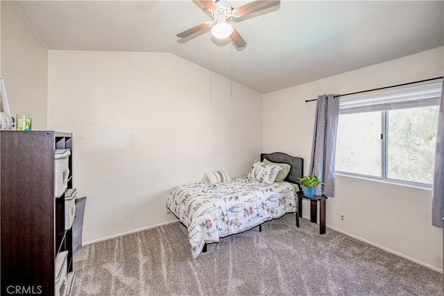 bedroom featuring carpet flooring, a ceiling fan, baseboards, and lofted ceiling